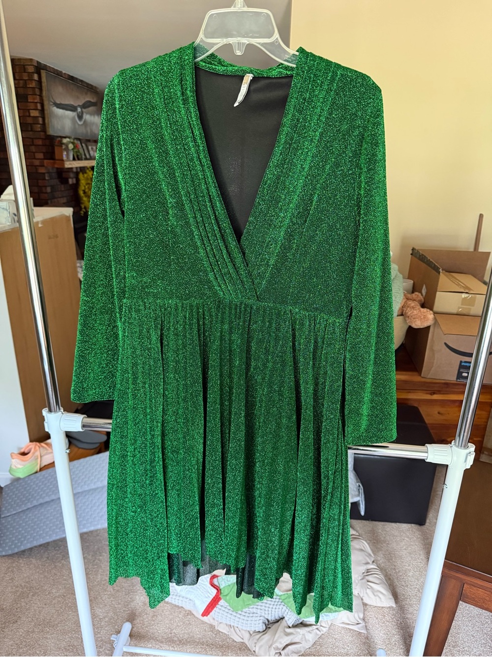 Green glitter side zip dress with pockets. High low cut skirt with lining